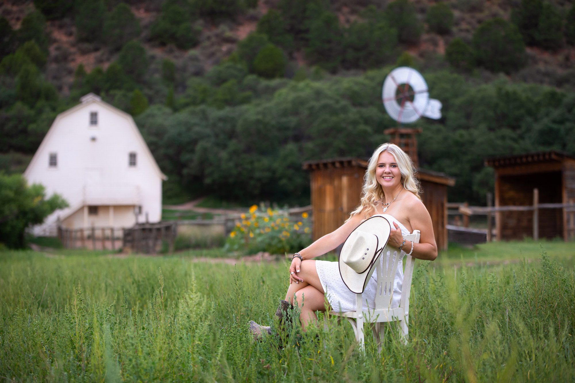 Girl in field on chair