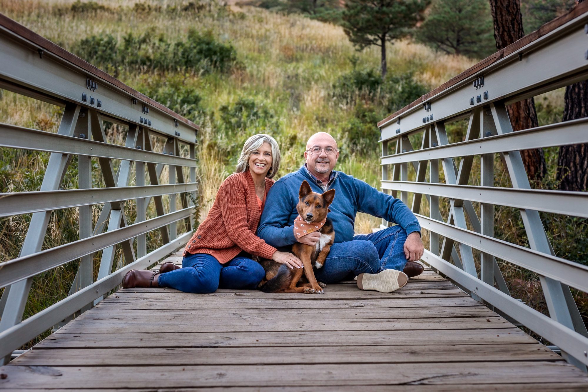 Couple on bridge with their dog