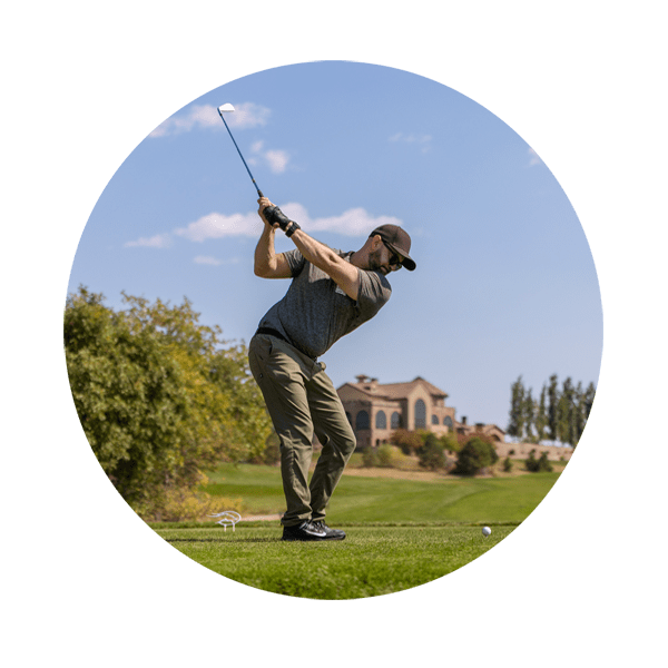 Man golfing at event